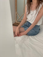 With Sleeveless Top
